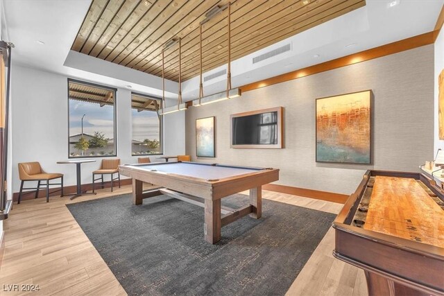 rec room with a tray ceiling, hardwood / wood-style floors, wooden ceiling, and pool table