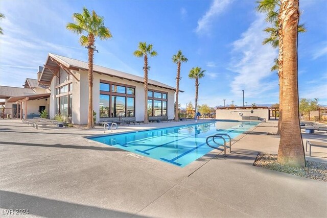 view of swimming pool with a patio area