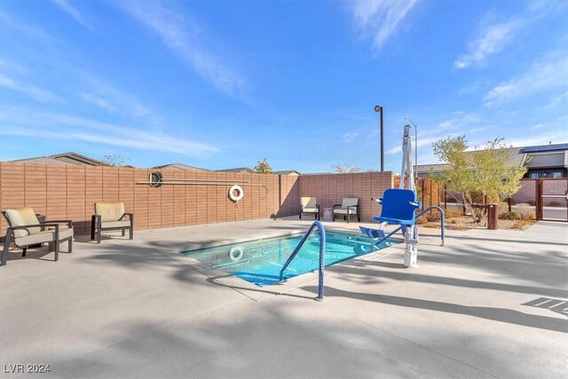 view of pool featuring a patio