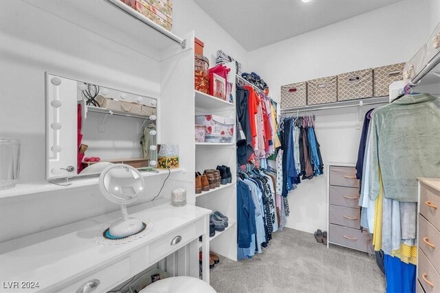 spacious closet with light colored carpet