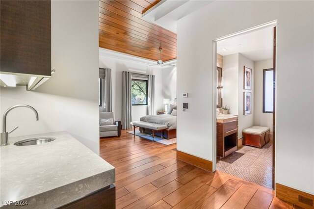 bathroom featuring wood-type flooring, vanity, ceiling fan, and wooden ceiling