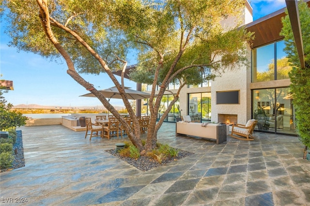 view of patio featuring an outdoor fireplace