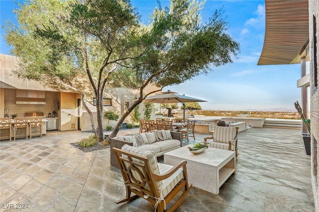 view of patio / terrace featuring exterior kitchen and an outdoor hangout area