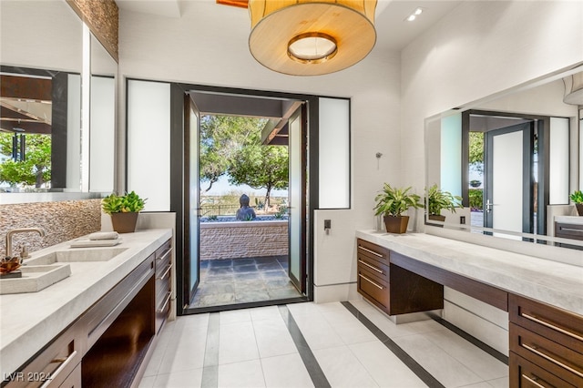 bathroom featuring tile patterned floors, vanity, and a wealth of natural light