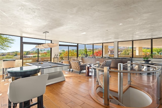 interior space with a wealth of natural light and pool table