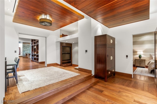 interior space with wood-type flooring and wooden ceiling