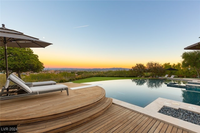 view of dock with a swimming pool side deck