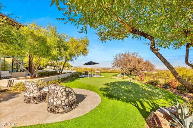 view of property's community with a patio area