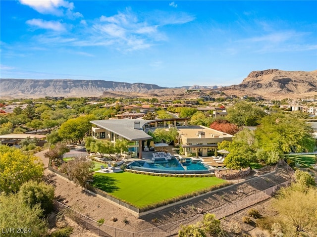 birds eye view of property featuring a mountain view