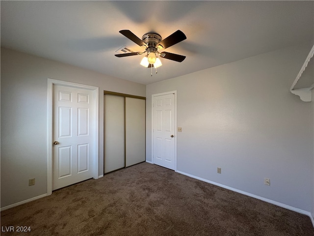 unfurnished bedroom featuring carpet and ceiling fan