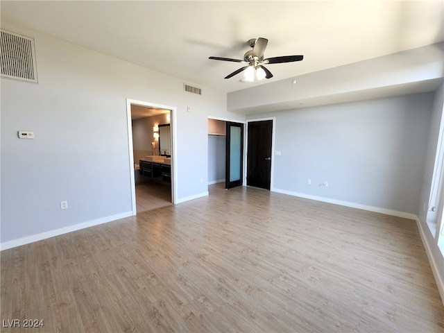 spare room featuring ceiling fan and light wood-type flooring