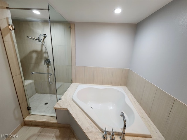 bathroom with tile patterned flooring and plus walk in shower