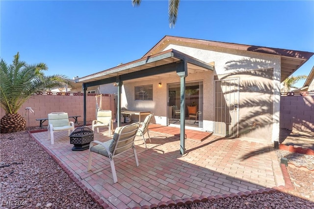 view of patio / terrace featuring a fire pit