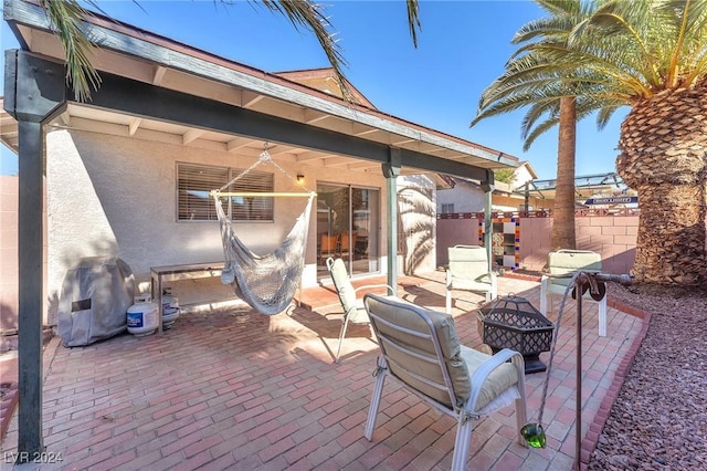 view of patio featuring a fire pit