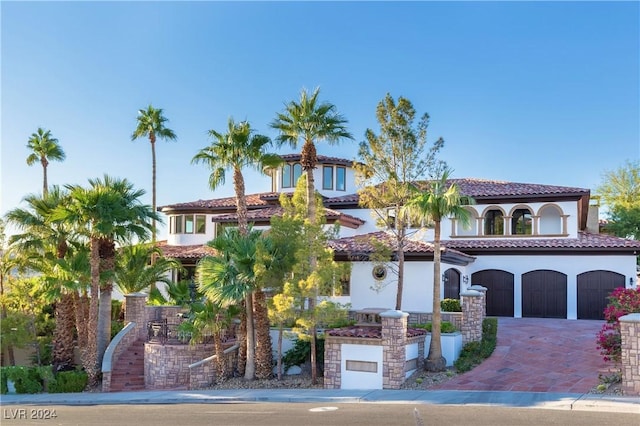 mediterranean / spanish-style house featuring a garage