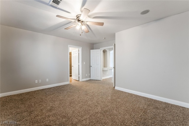 carpeted empty room with ceiling fan