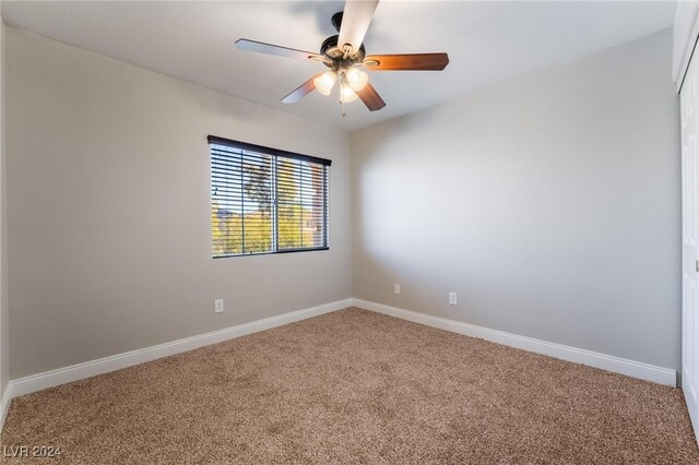 unfurnished room featuring carpet and ceiling fan