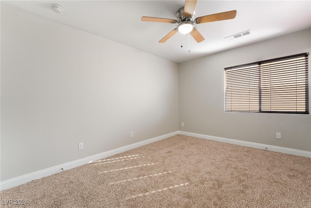 empty room with carpet flooring and ceiling fan