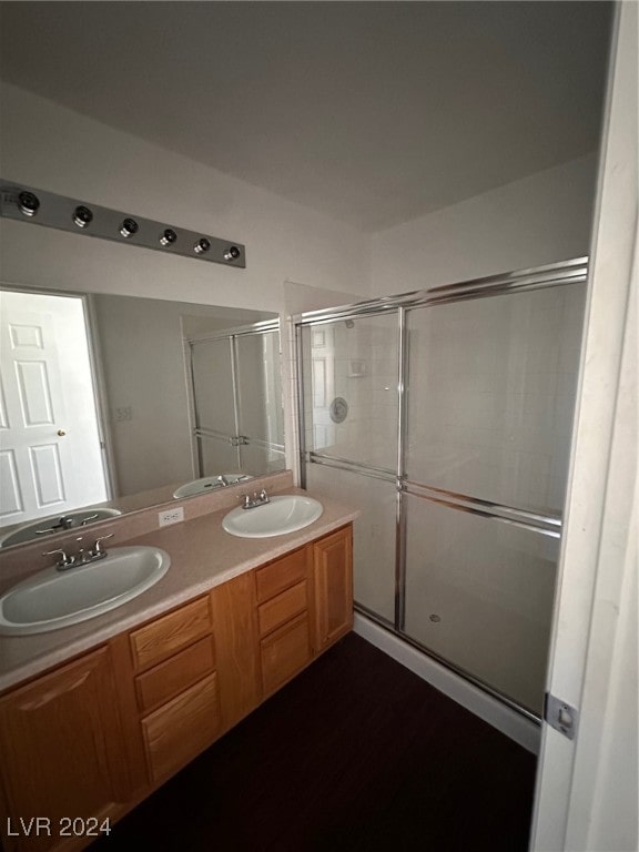 bathroom featuring vanity and walk in shower