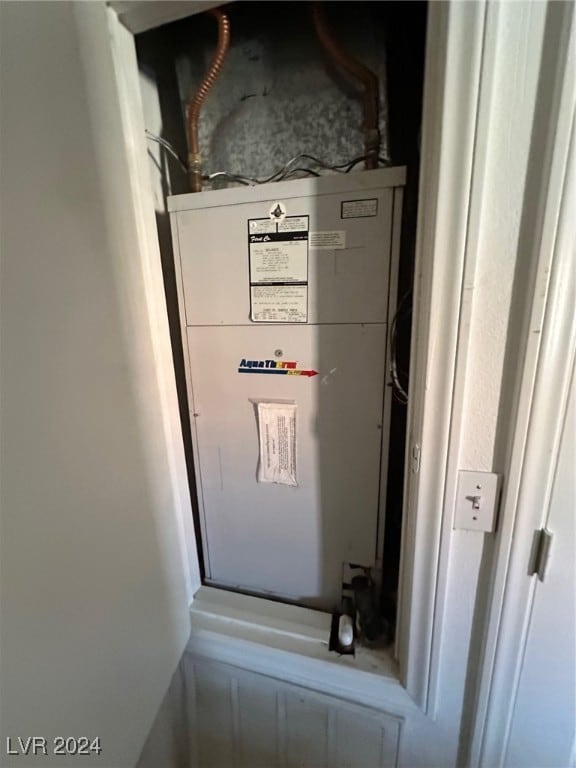 utility room featuring heating unit