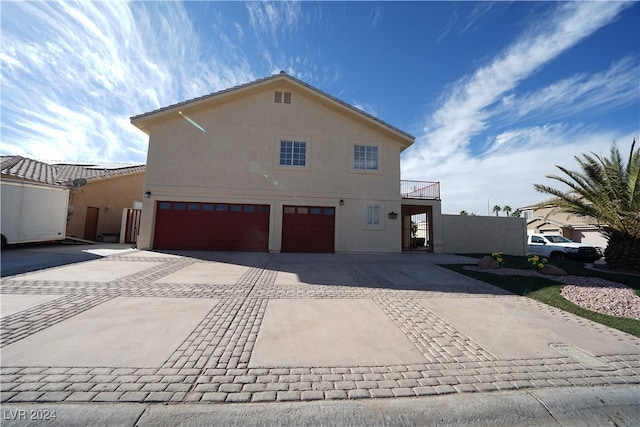 view of side of property with a garage