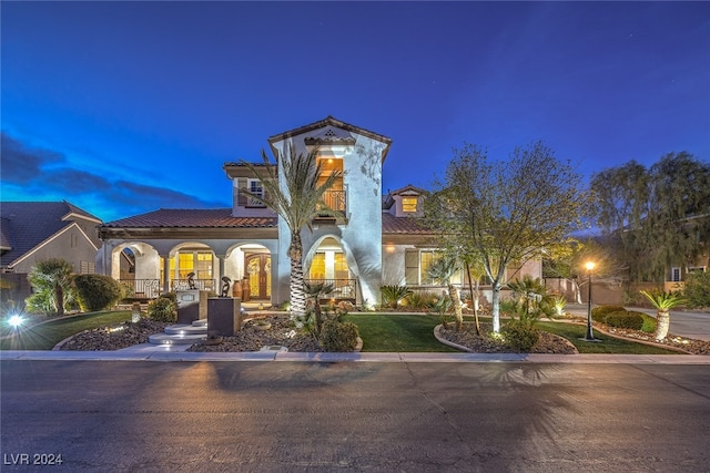 mediterranean / spanish-style house with covered porch