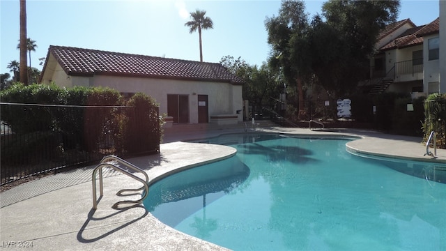 view of swimming pool with a patio