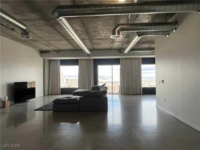 living room featuring concrete flooring