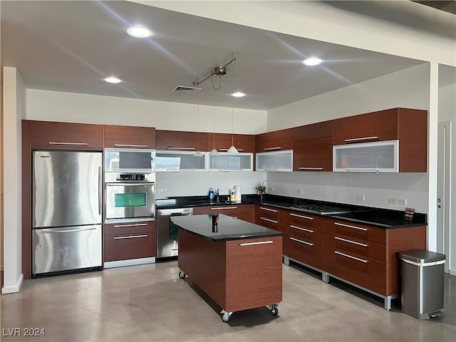 kitchen featuring pendant lighting, a center island, and stainless steel appliances