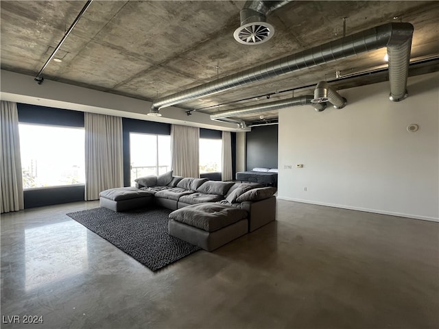 living room featuring concrete flooring