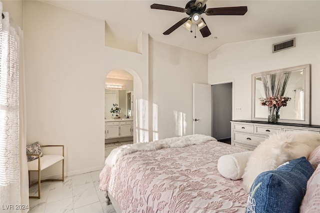 bedroom with connected bathroom, ceiling fan, and lofted ceiling