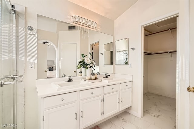 bathroom with vanity and vaulted ceiling