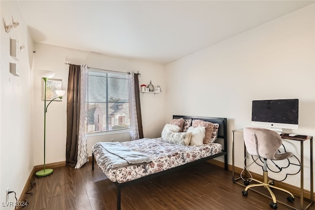 bedroom featuring dark hardwood / wood-style flooring