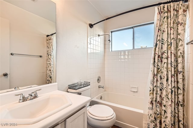 full bathroom featuring vanity, toilet, and shower / tub combo with curtain