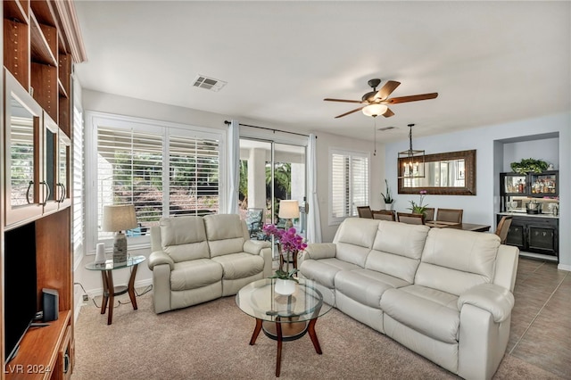 living room featuring tile patterned flooring and ceiling fan