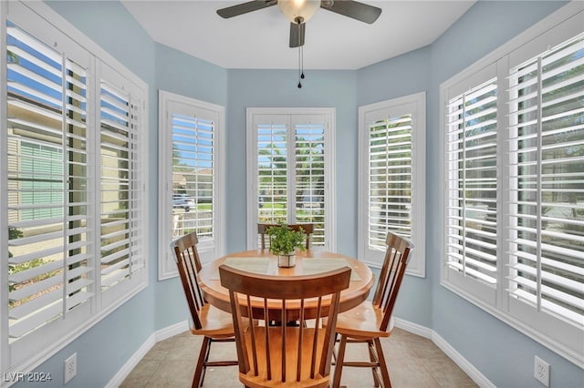 tiled dining room with ceiling fan