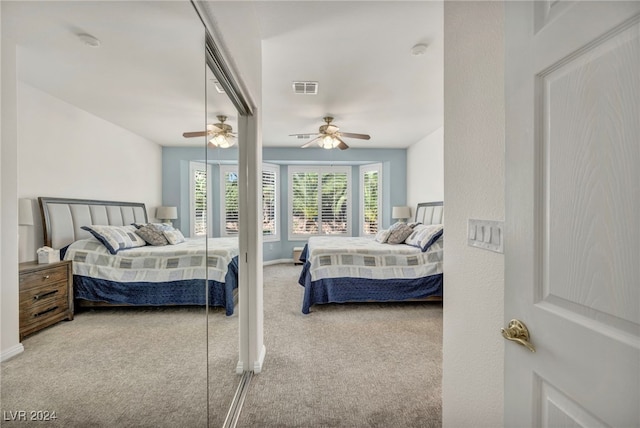 carpeted bedroom featuring ceiling fan