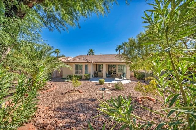 back of property with a patio area