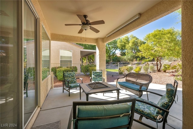 view of patio with an outdoor living space and ceiling fan