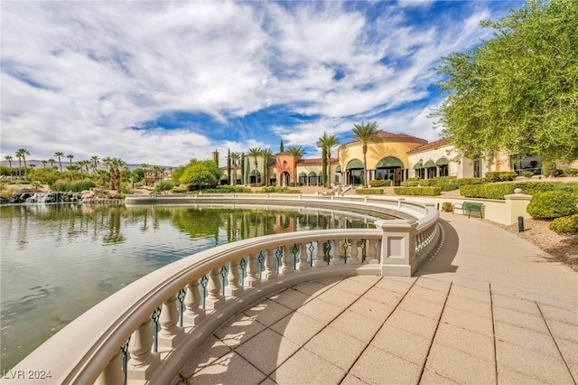 surrounding community featuring a water view