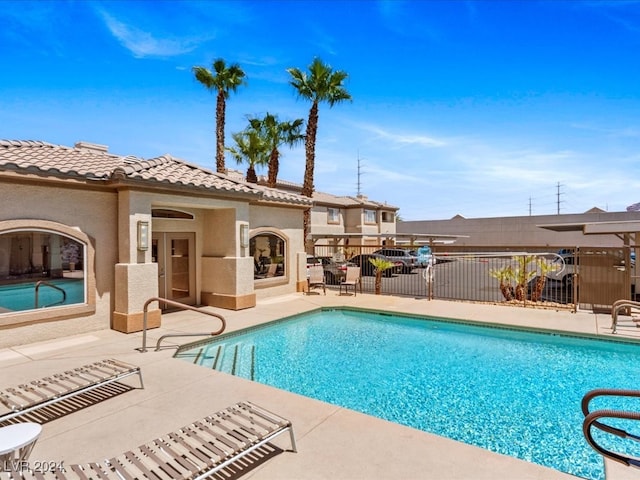 view of swimming pool featuring a patio area