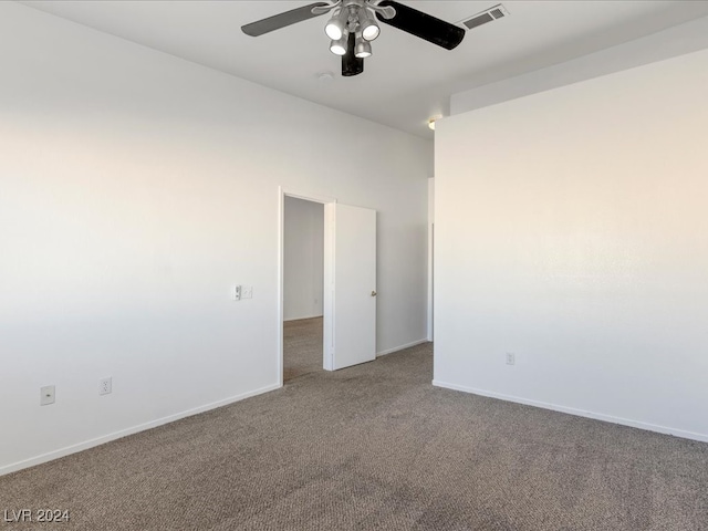 empty room featuring carpet and ceiling fan