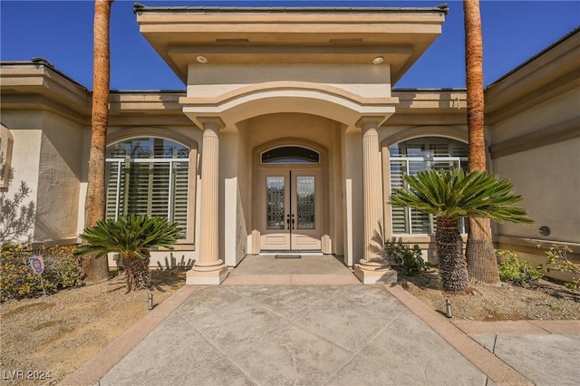 doorway to property featuring french doors