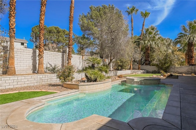 view of swimming pool with an in ground hot tub