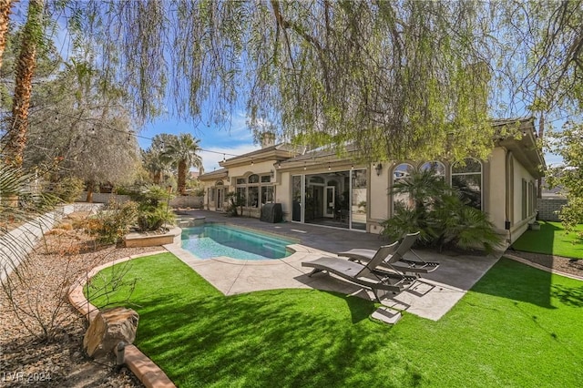 view of pool featuring a yard and a patio area