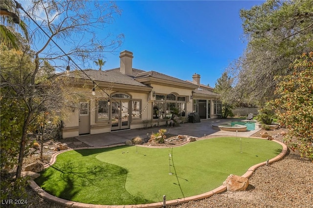 rear view of house featuring a patio area