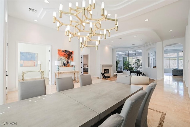 dining room featuring light tile patterned flooring and a chandelier