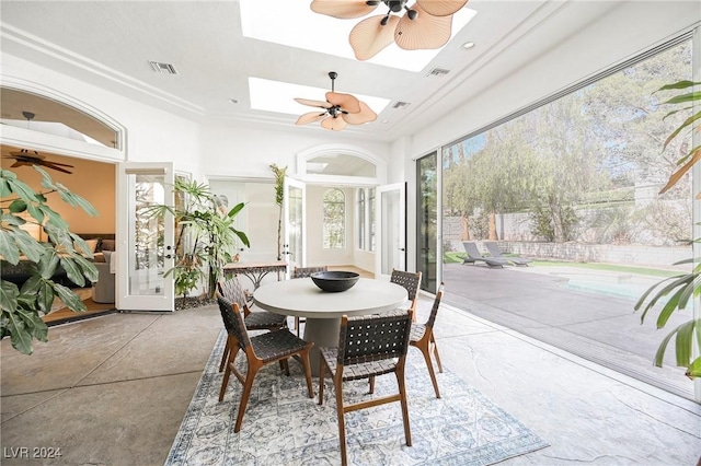 interior space featuring a skylight and ceiling fan