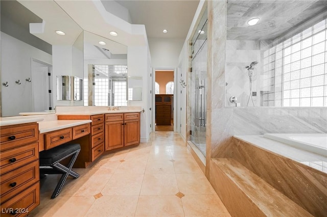 bathroom featuring vanity, independent shower and bath, and tile patterned flooring