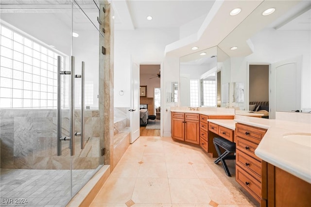 bathroom with ceiling fan, vanity, an enclosed shower, and tile patterned flooring